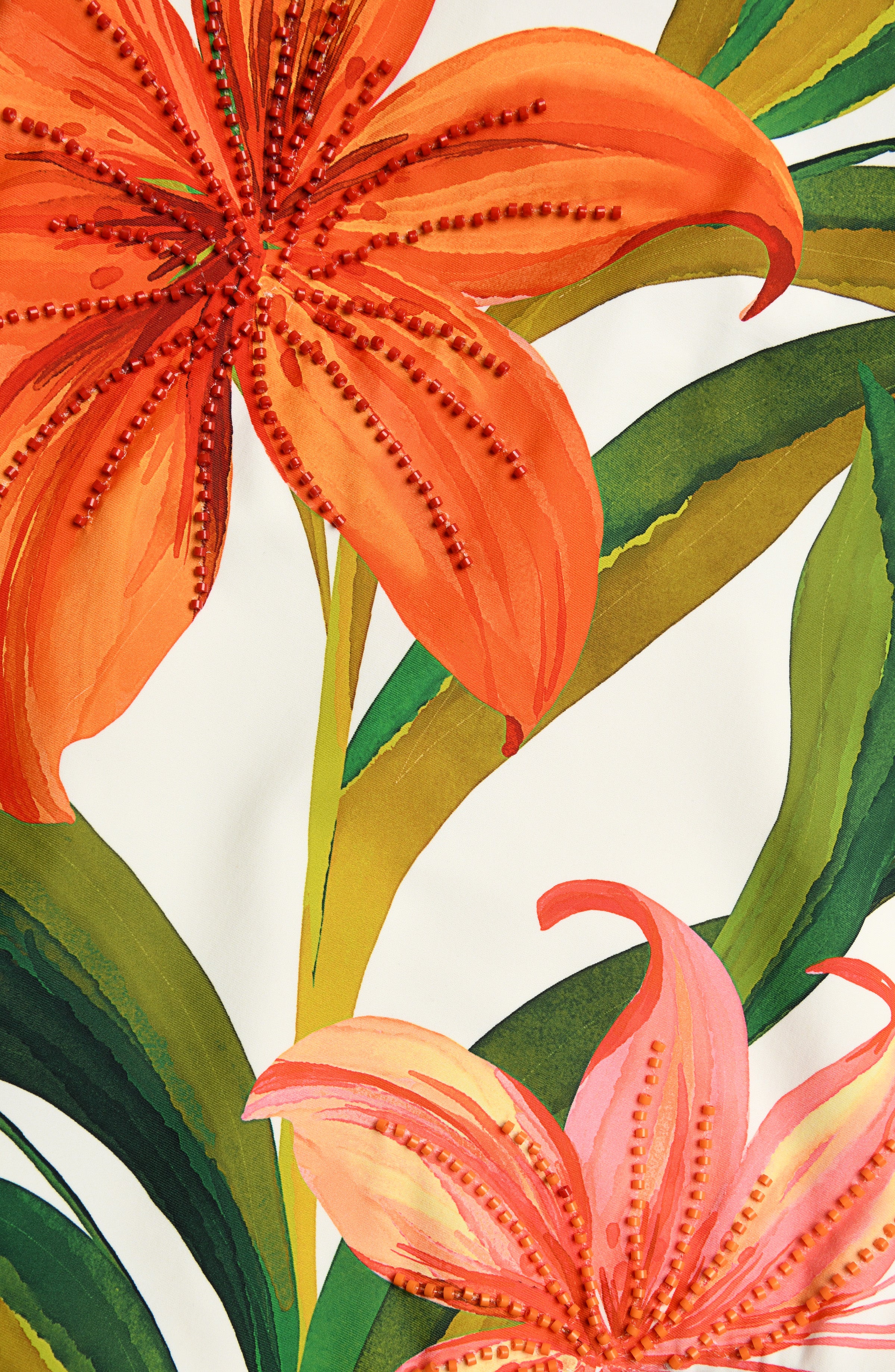 Close-up image of a floral one piece swimsuit with beading detail