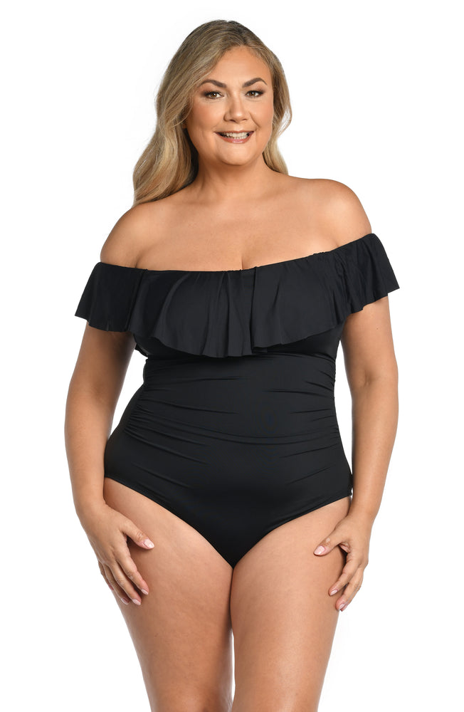 
            
                Load image into Gallery viewer, Model is wearing a black one piece swimsuit from our Best-Selling Island Goddess collection.
            
        