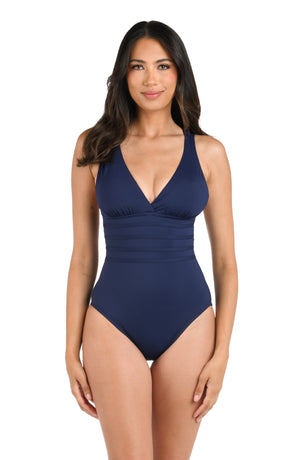 Model is wearing an indigo one piece swimsuit from our Best-Selling Island Goddess collection.