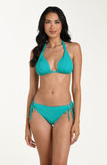 Front image of model wearing a calypso (turquoise) colored halter bikini top with triangle cups and a tie at the neck. This is paired with matching bikini bottoms.