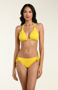 Woman wearing a yellow bikini top and matching bottom against a white background. 