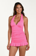 Front image of model wearing a rose pink colored halter-neck tankini top with a plunging neckline and ruched detailing. This is paired with matching a bottom.