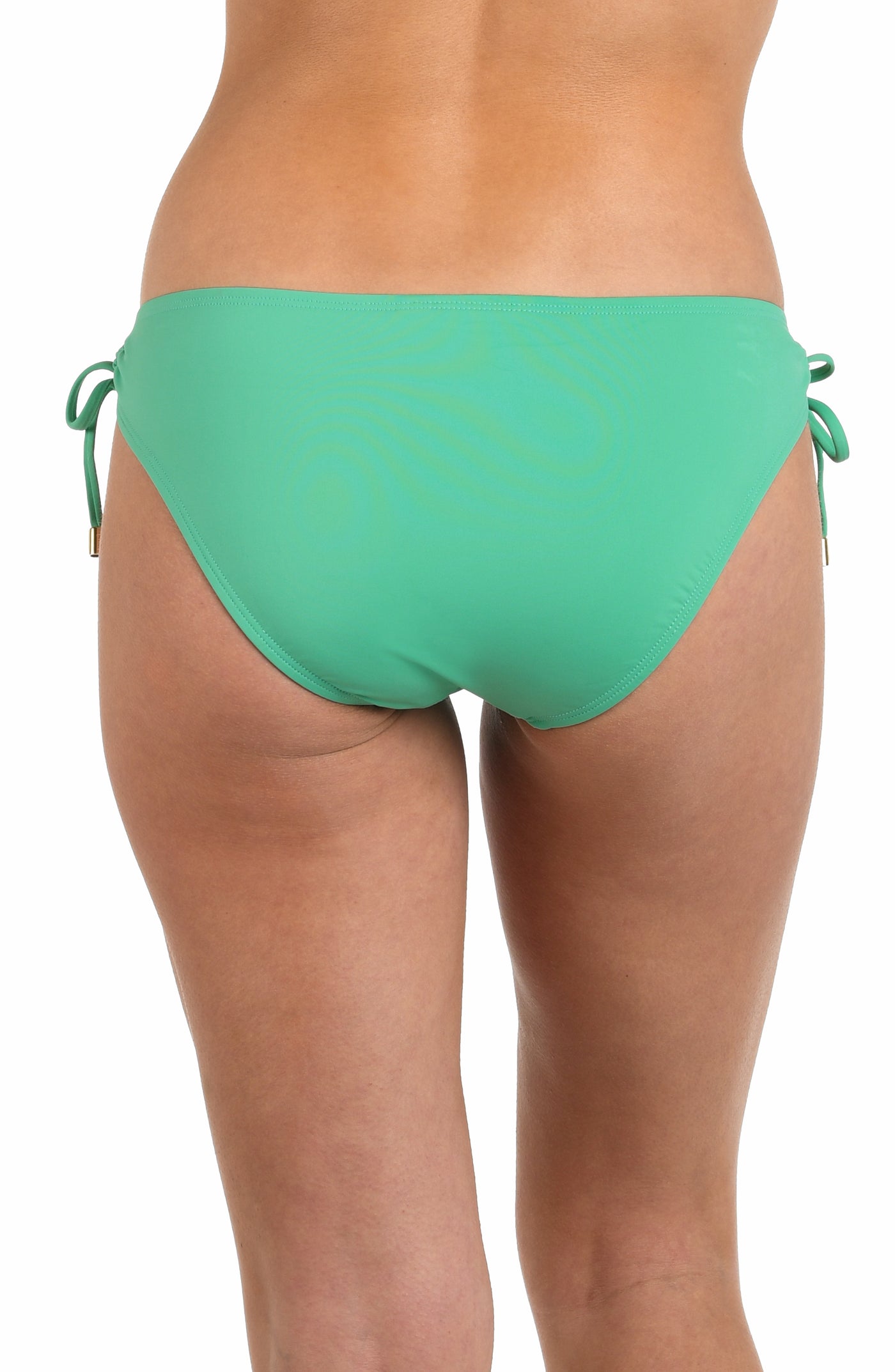 
                  
                    Back image of model wearing a solid eucalyptus colored hipster bikini bottom featuring adjustable loop side ties with gold cord ends, and moderate rear coverage.
                  
                