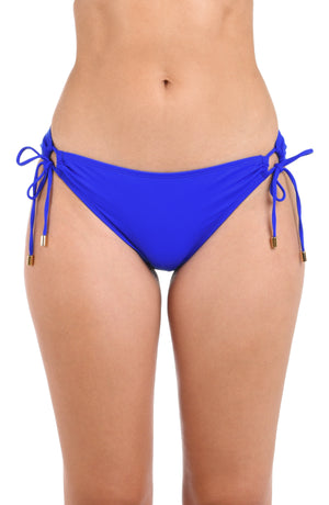 Model is wearing a sapphire side-tie hipster swimsuit bottom from our Best-Selling Island Goddess collection.