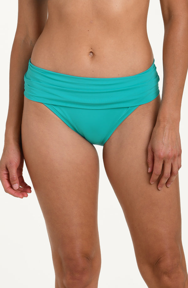 Front image of model wearing calypso (turquoise) colored bikini bottoms with a wide, ruched waistband.