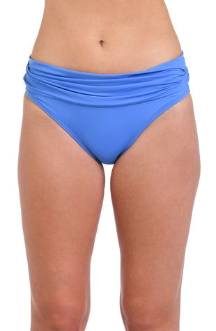 Model is wearing a solid chambray (light blue) colored hipster swimsuit bottom.
