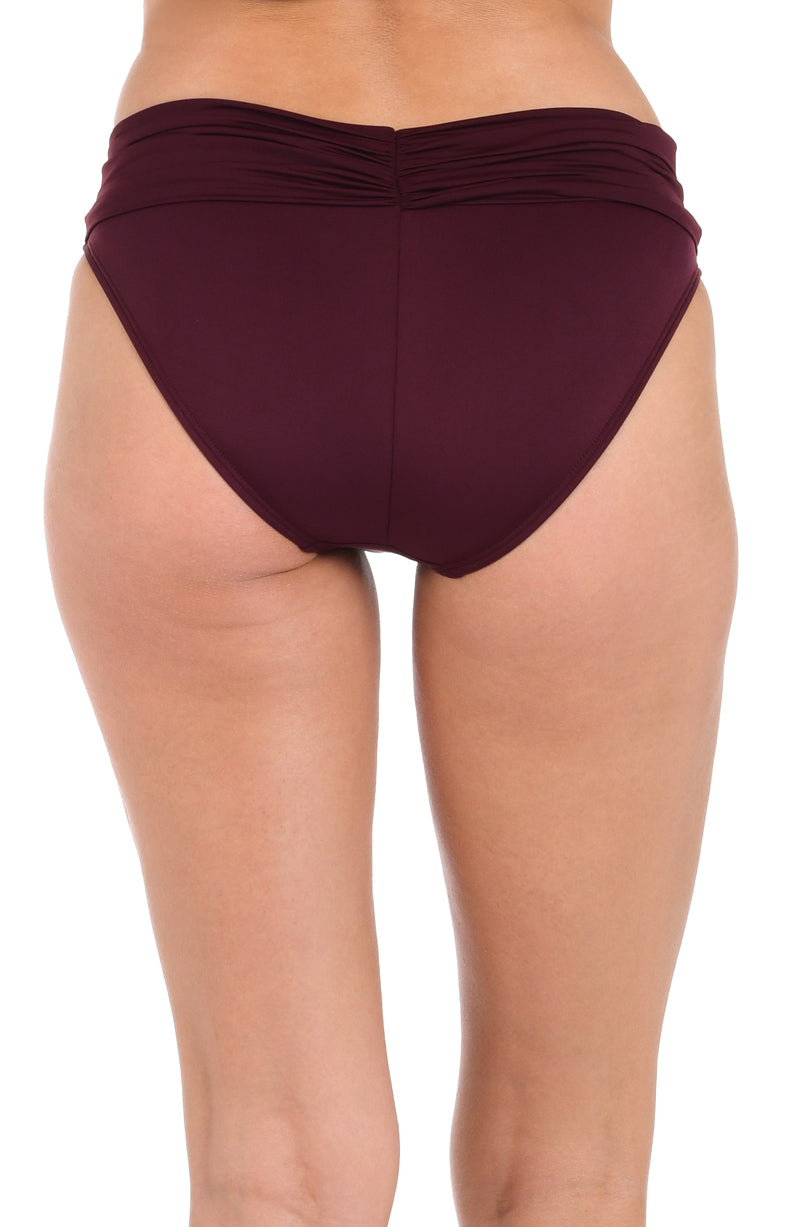 Model is wearing an Island Goddess Shirred Band Hipster Bottom in Dark Cherry.