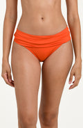 Front image of model wearing a tangelo (orange) colored bikini bottoms with a wide, ruched waistband.