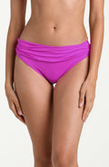 Violet bikini bottom worn by a person on a white background