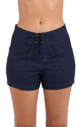 Model is wearing an indigo board short swimsuit from our All Aboard collection.