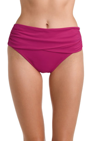 Model is wearing a multicolored Island Goddess Mid Waist Pant Bikini Swimsuit Bottom
