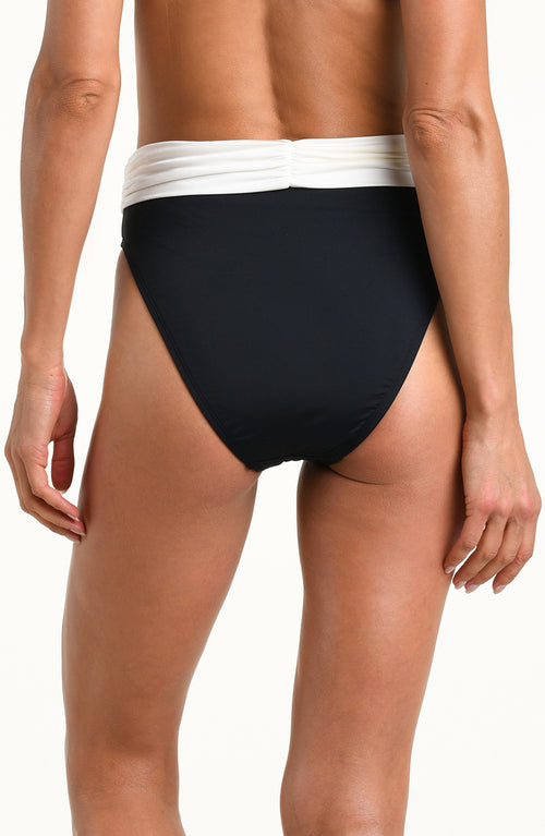 Rear view of a model wearing high-waisted black bikini bottoms with a contrasting white ruched waistband, set against a plain white background.
