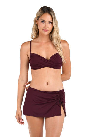 Model is wearing an Island Goddess Over the Shoulder Wrap Top in Dark Cherry.