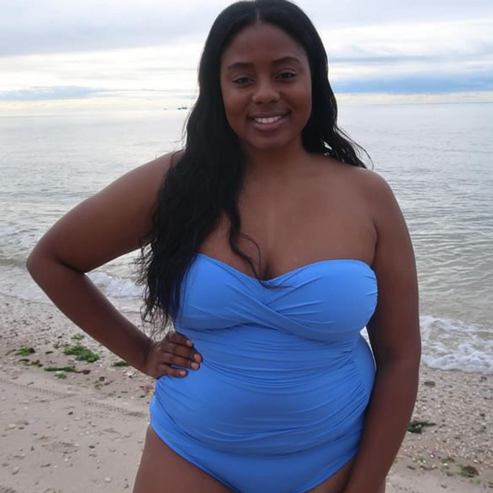 
                  
                    UGC image of woman wearing a solid chambray (light blue) colored bandeau tankini swimsuit top.
                  
                