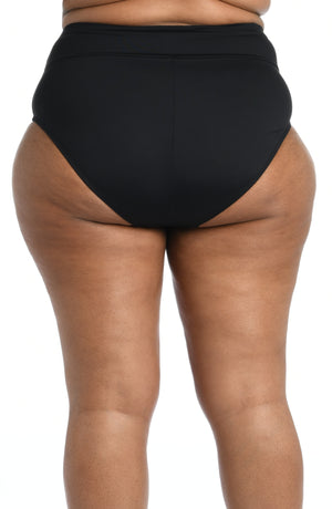 Model is wearing a black high waist swimsuit bottom from our Best-Selling Island Goddess collection.
