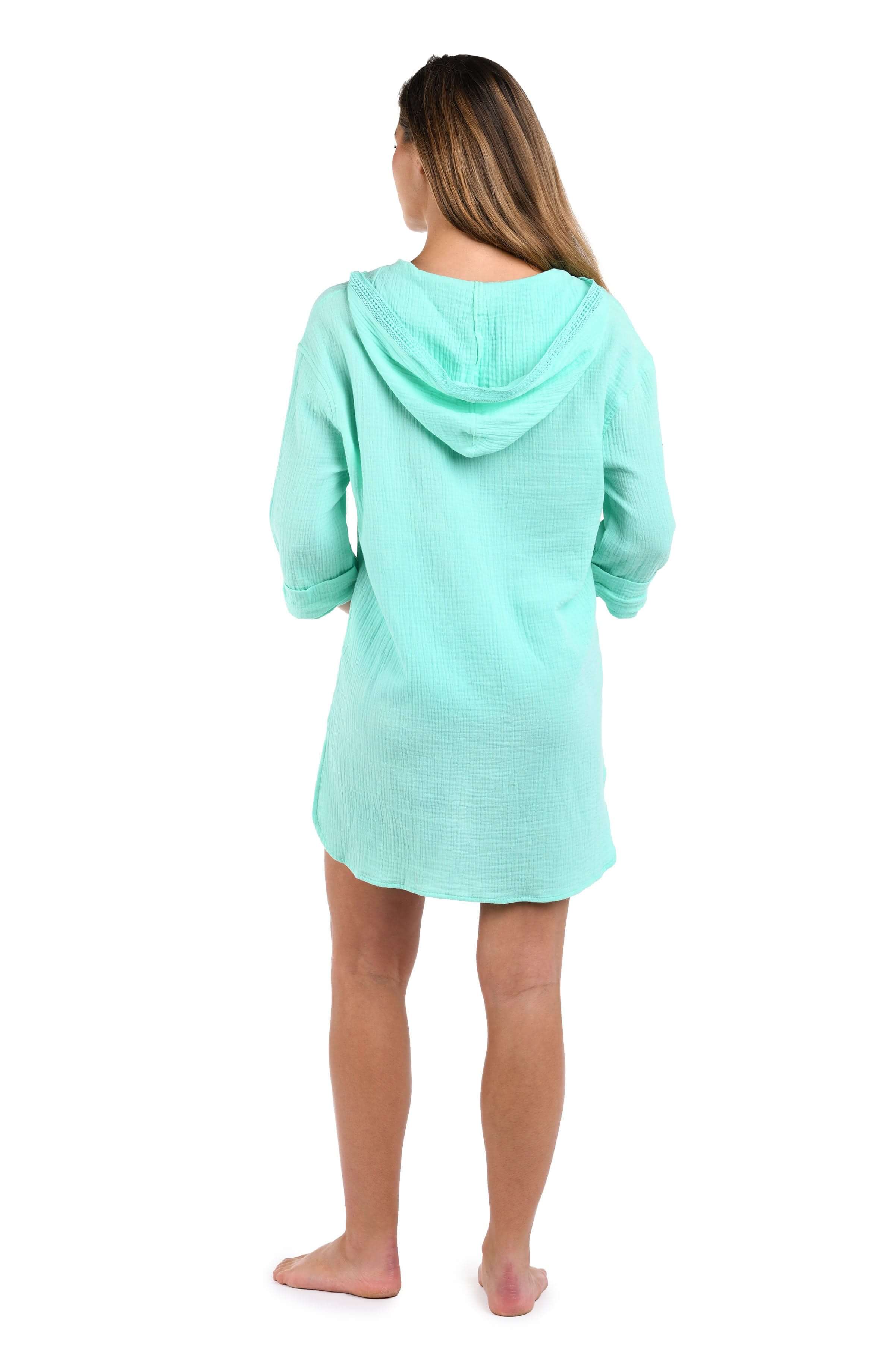 Back image of model wearing the Seaside Covers Hoodie in Seabreeze