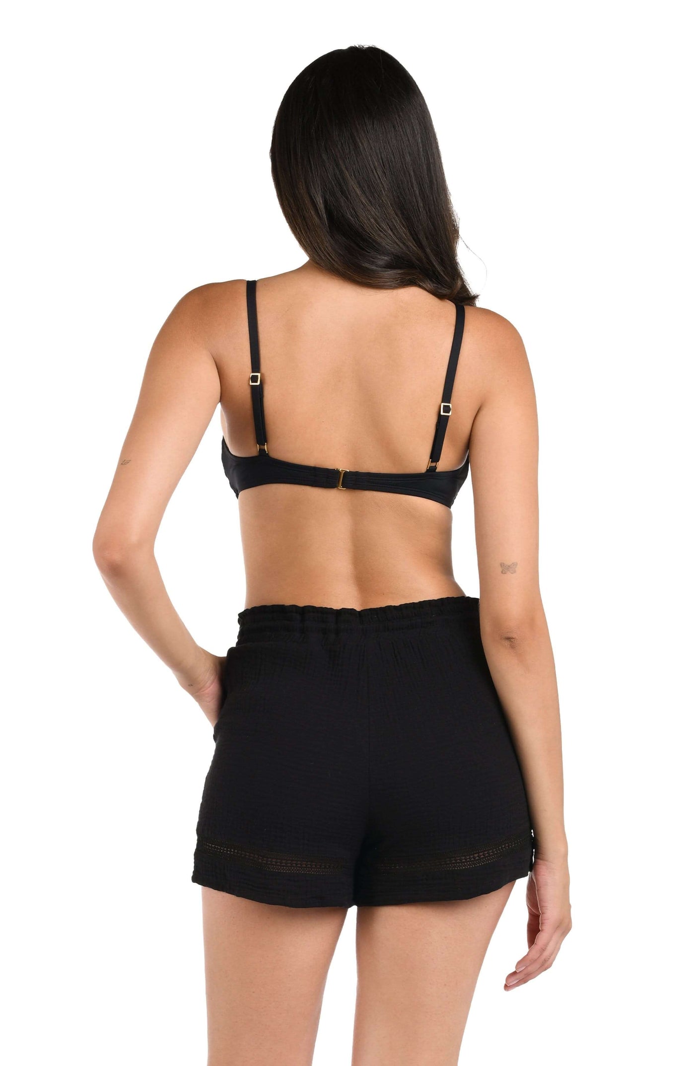 
                  
                    Model is wearing black beach shorts from our Seaside Covers collection.
                  
                