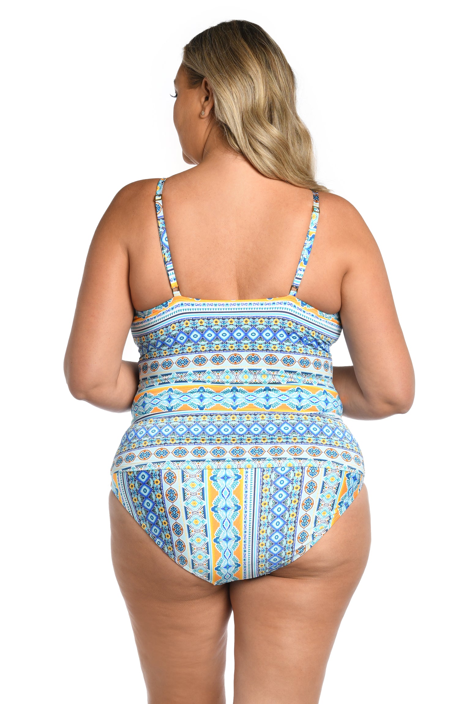 Model is wearing a blue multicolored mediterranean printed keyhole tankini top from our Scarf City collection.