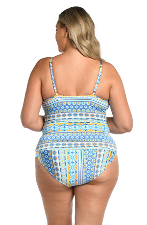 
            
                Load image into Gallery viewer, Model is wearing a blue multicolored mediterranean printed keyhole tankini top from our Scarf City collection.
            
        