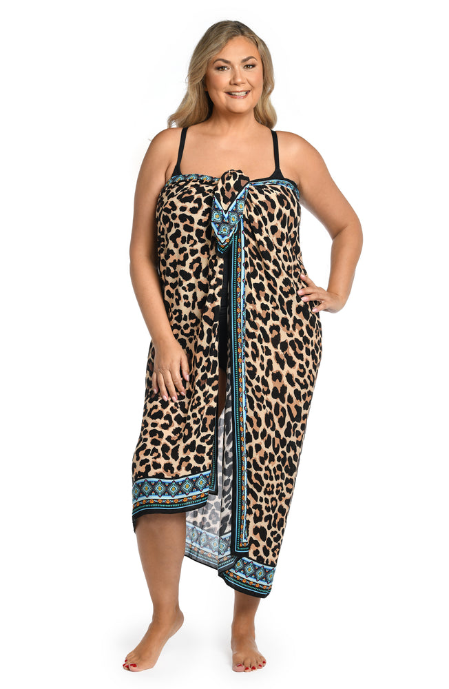 Model is wearing a dual aqua blue and leopard printed pareo wrap cover up from our Running Wild collection.