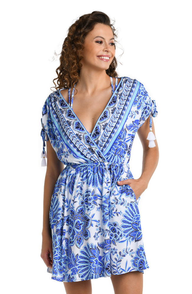 Model is wearing an indigo and white multicolored floral printedV-Neck Cover Up Dress