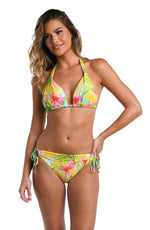 Model is wearing a bright yellow, pink, and green multicolored tropical printed Halter Triangle Top