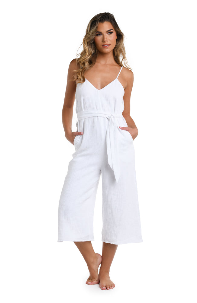 Model is wearing a solid white colored Wide Leg Jumpsuit Cover Up