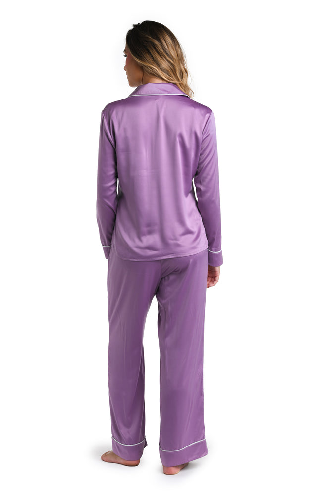 Model is wearing a purple and white pajama set from our Rest Assured collection.