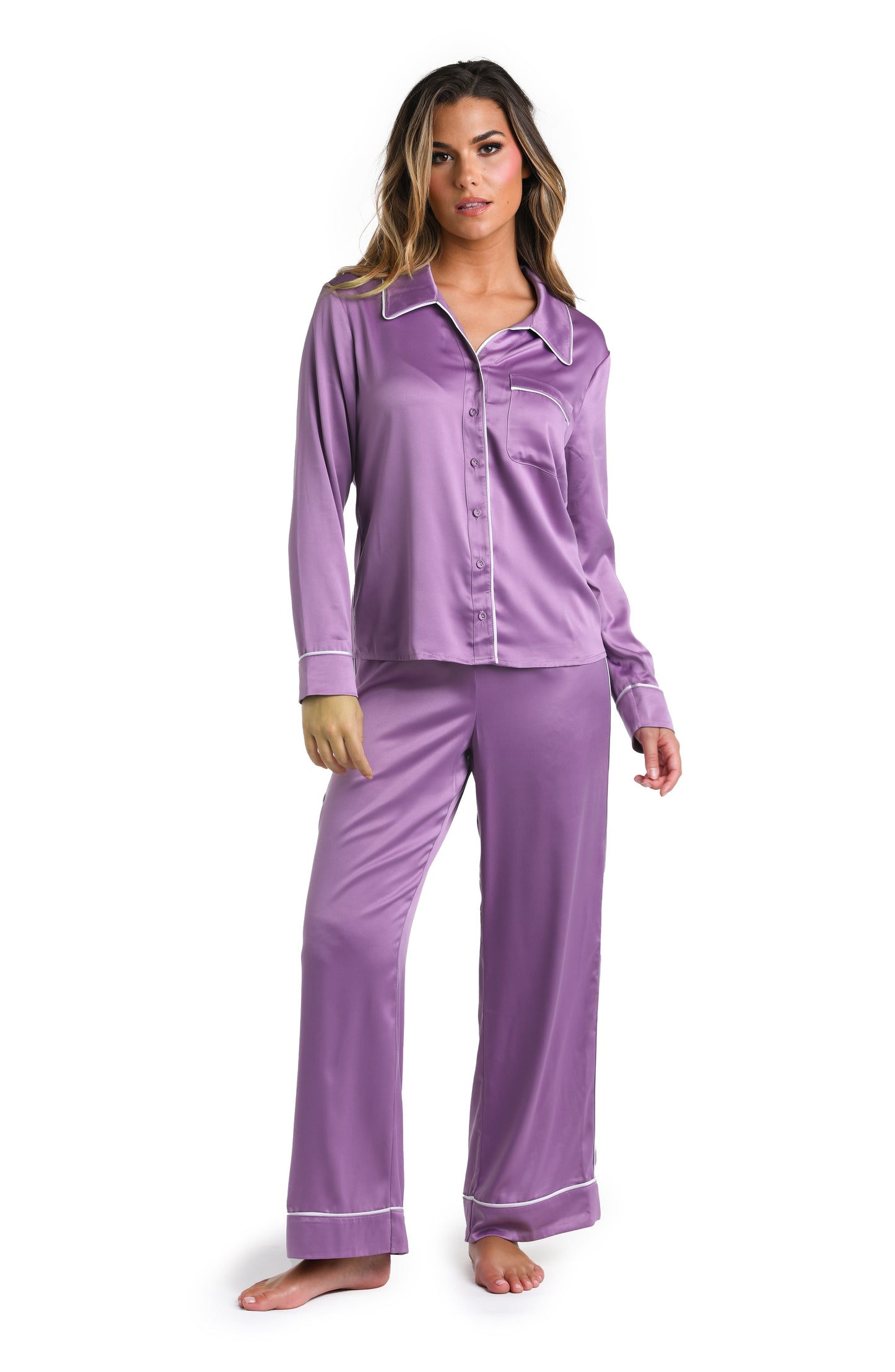 Model is wearing a purple and white pajama set from our Rest Assured collection.