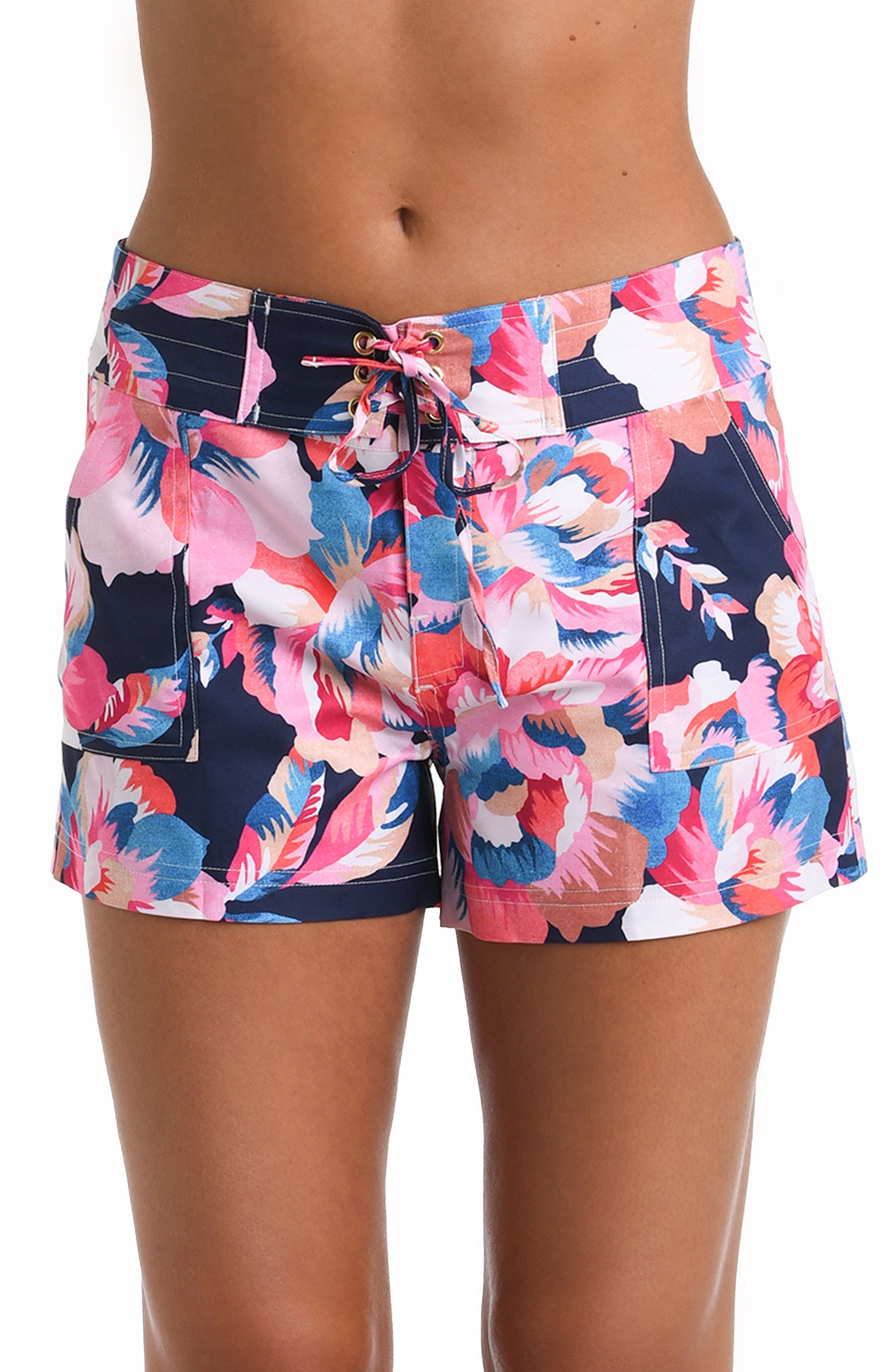 Model is wearing a floral beach short from the Denim Bouquet collection.