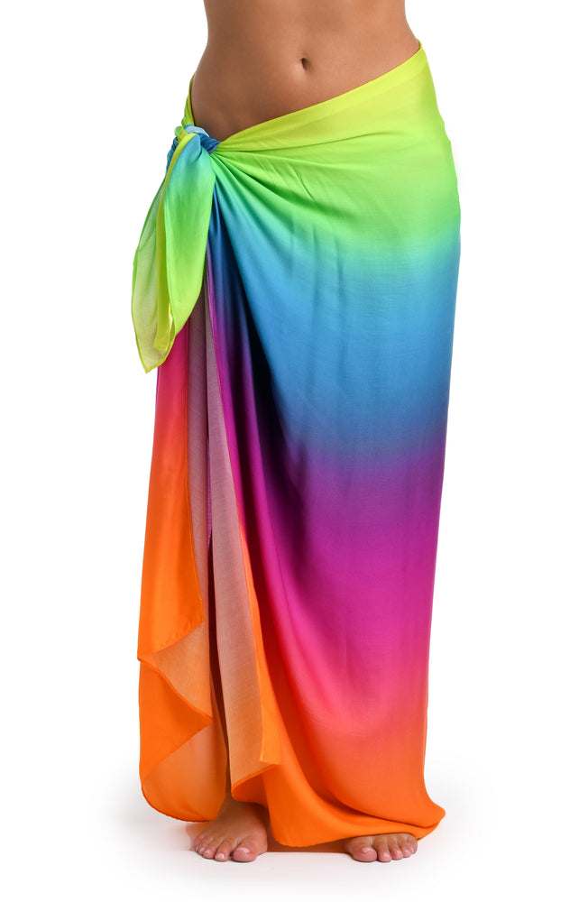 
            
                Load image into Gallery viewer, Model is wearing a multicolored Pareo Wrap Swimsuit Cover Up
            
        