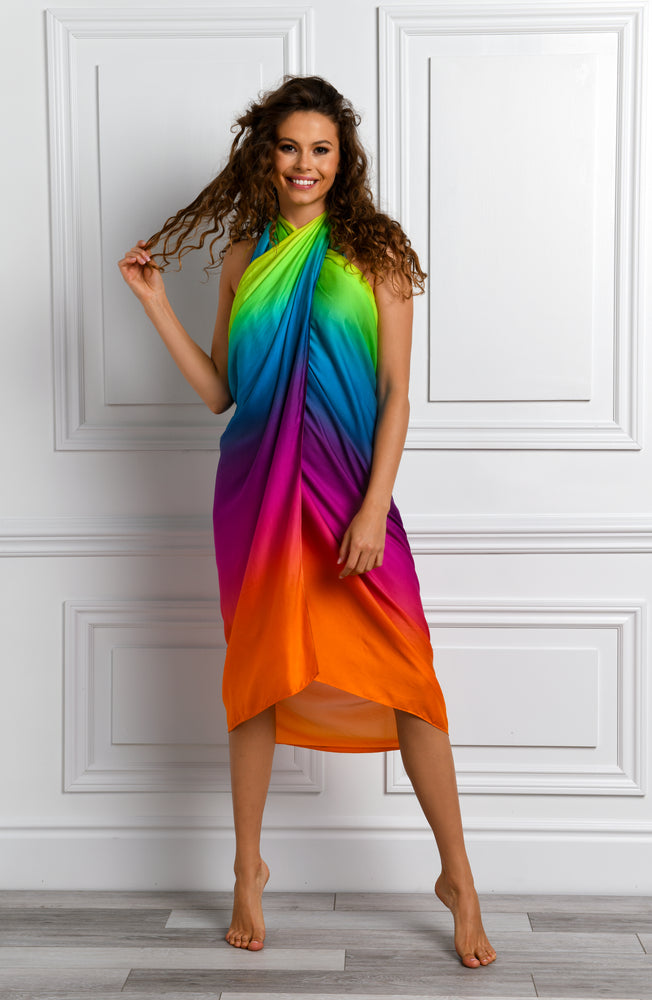 
            
                Load image into Gallery viewer, Model is wearing a multicolored Pareo Wrap Swimsuit Cover Up
            
        