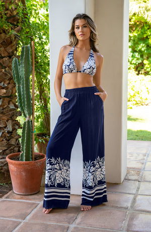 Model is wearing an indigo and white Beach Bungalow Palazzo Pant Swimsuit Cover Up