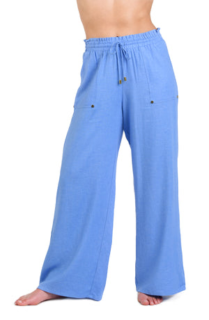 Model is wearing a solid chambray (light blue) colored beach pant cover up.