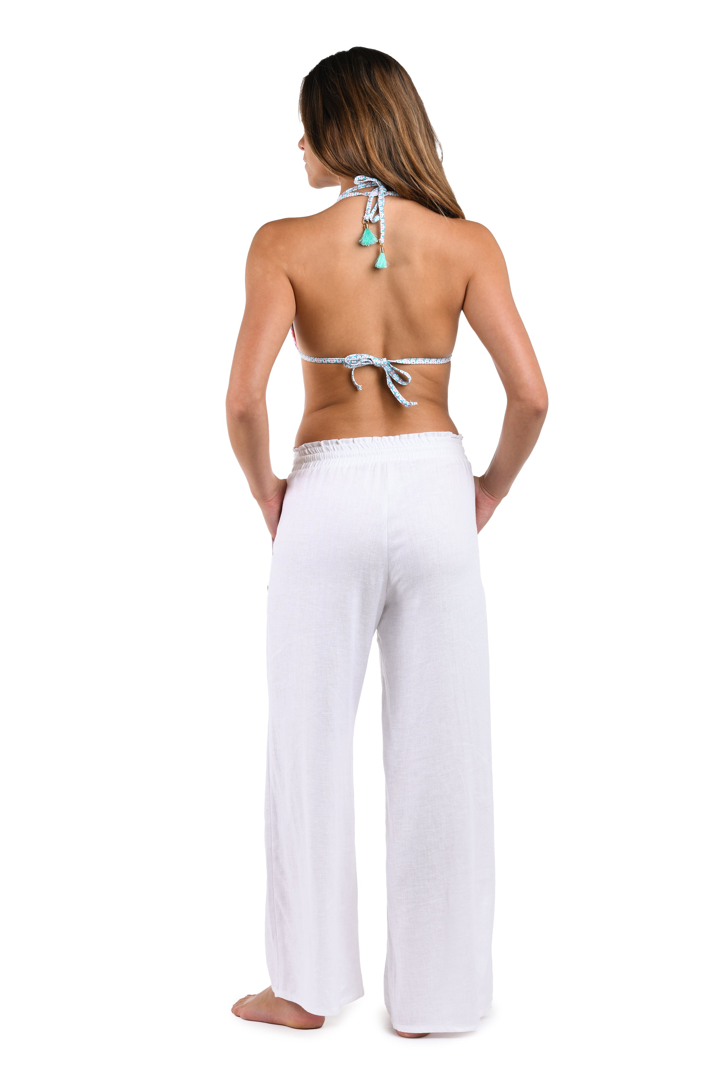 Back image of model wearing the Delphine Coast Beach Pant Cover Up in white.