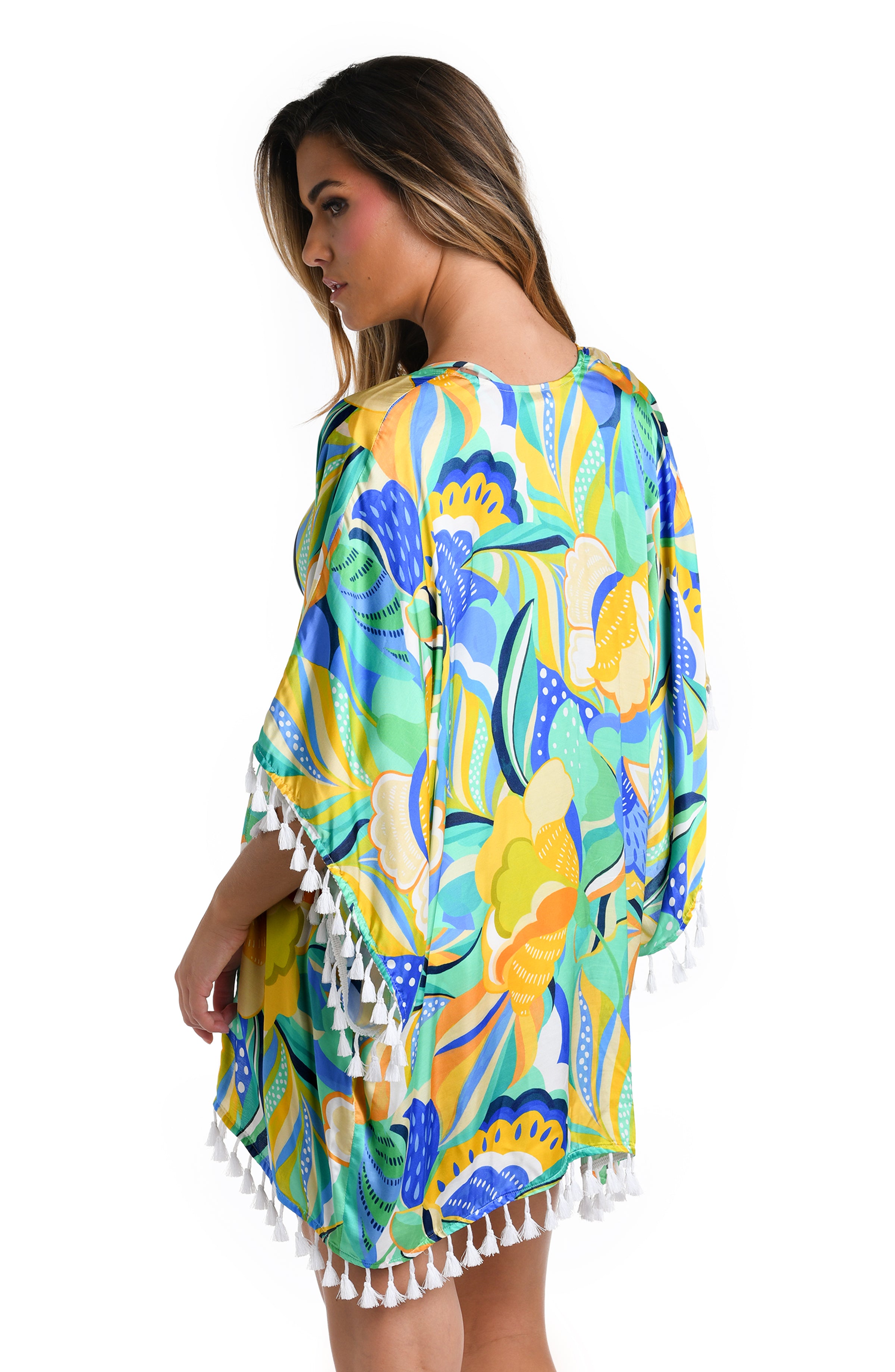 Back image of model wearing a multicolored Kimono Swimsuit Cover Up featuring dolman sleeves, a clean back adorned with tassels.