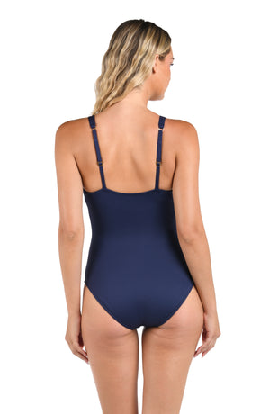 Model is wearing a LB LUXE Plunge Keyhole One Piece in Indigo.