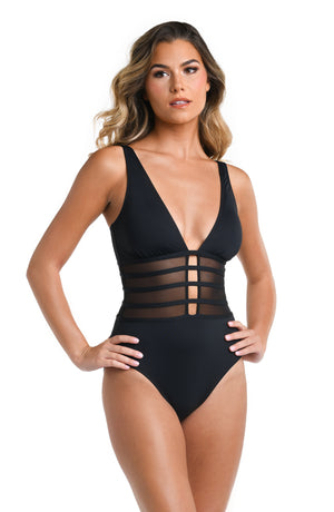 Model is wearing a multicolored Island Goddess Mesh Over The Shoulder One Piece Swimsuit