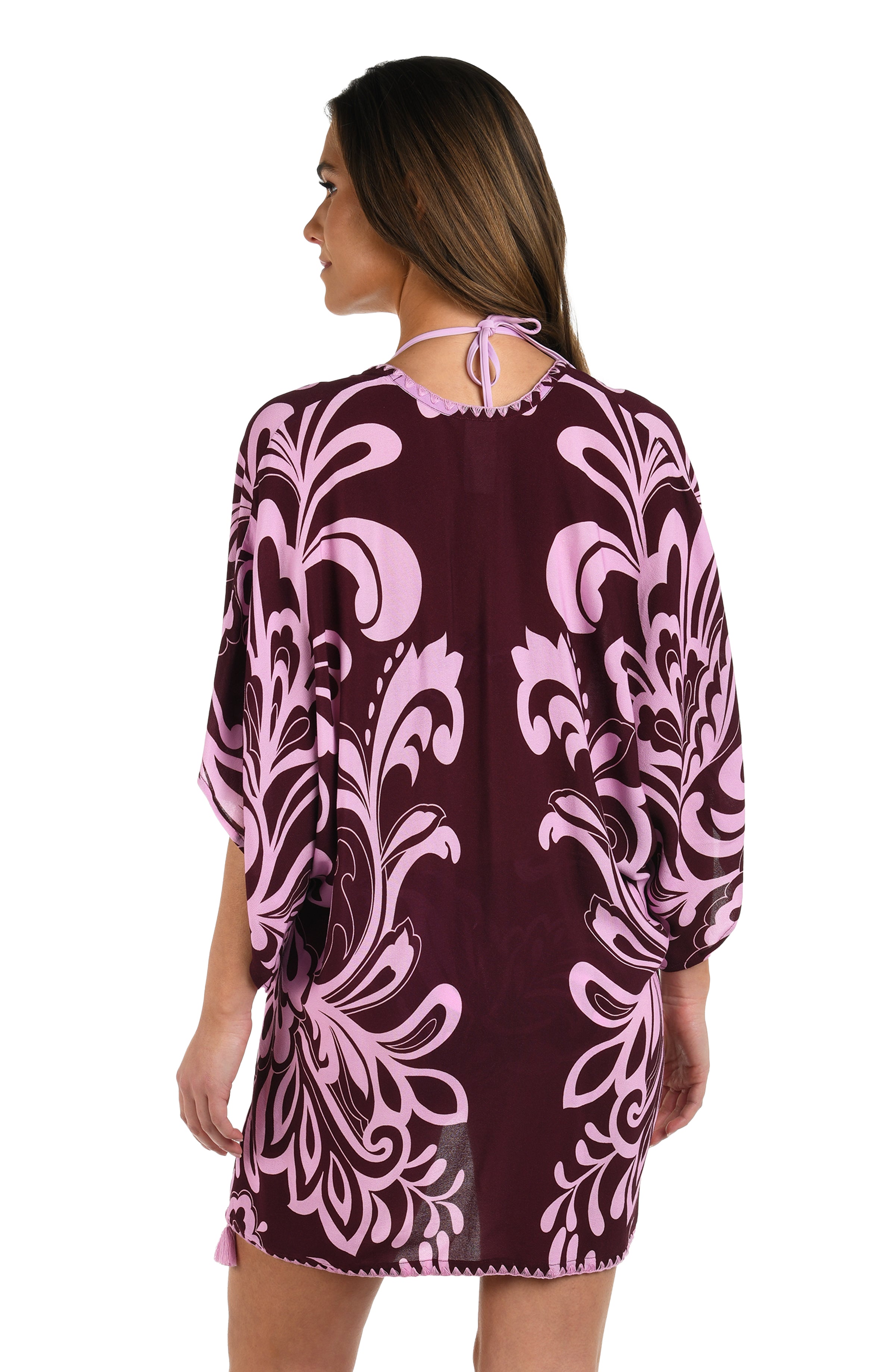 Back image of model wearing a dark cherry and pink tropical patterned open front kimono cover up. 