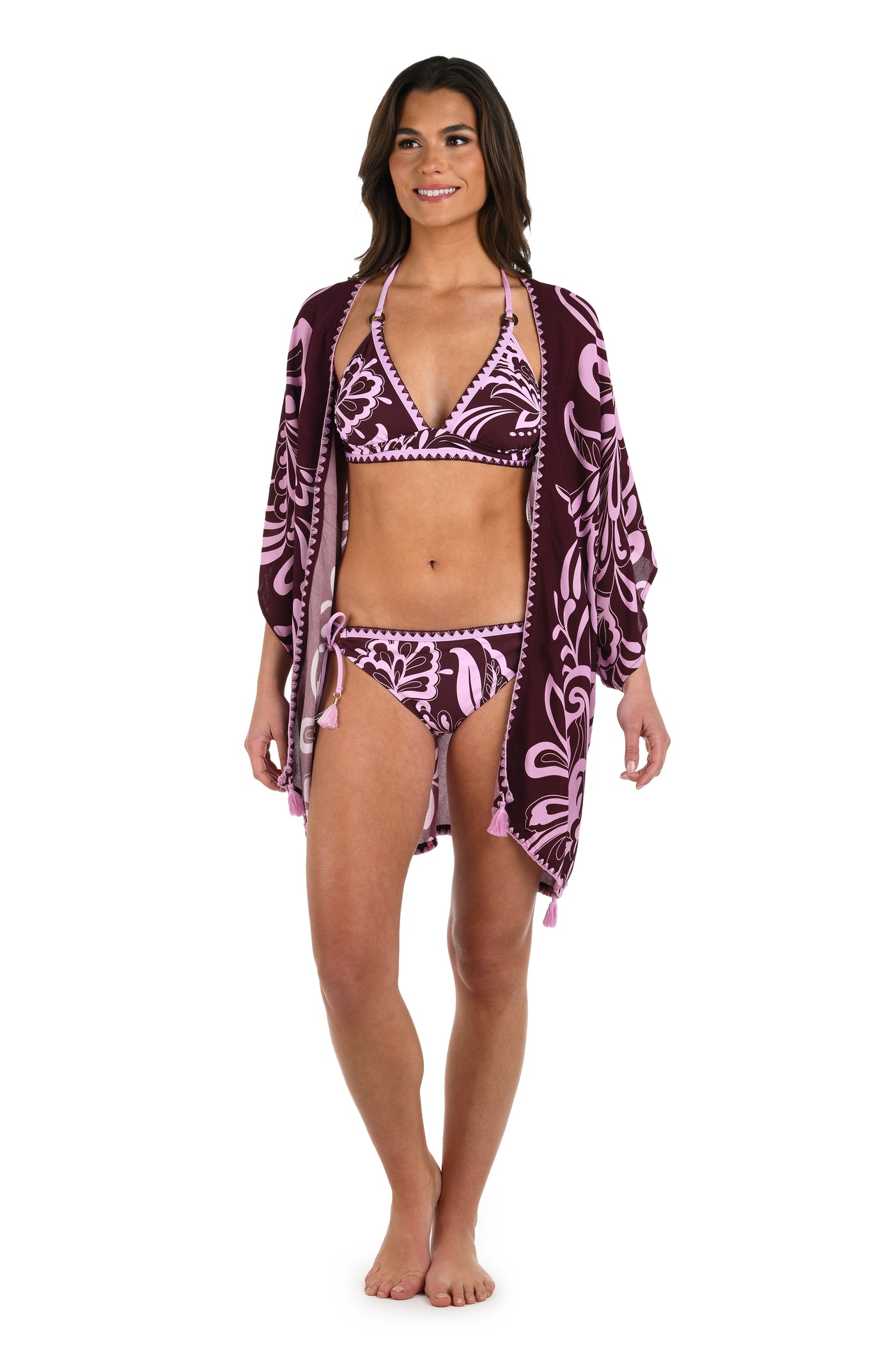 
                  
                    Full body front image of model wearing a dark cherry and pink tropical patterned open front kimono cover up. 
                  
                