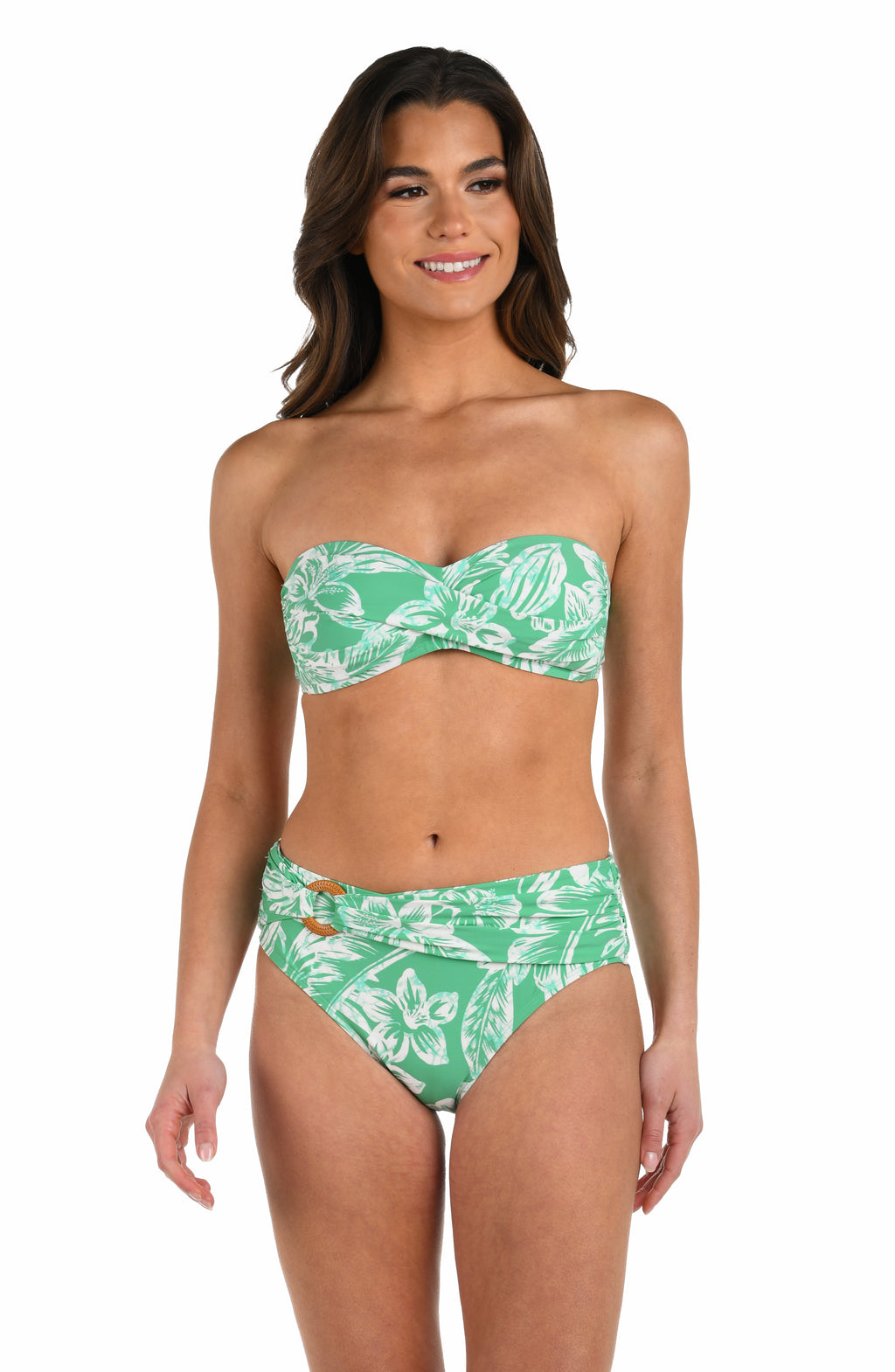 Front image of model wearing a green and white floral-printed bandeau bikini top featuring a twist front and no shoulder straps. 