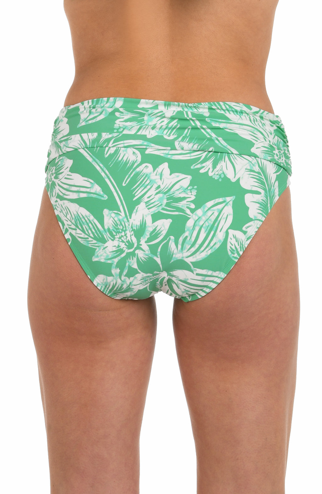 Back image of model wearing a green and white floral-printed mid-waist bikini bottom featuring a shirred band, and moderate rear coverage.