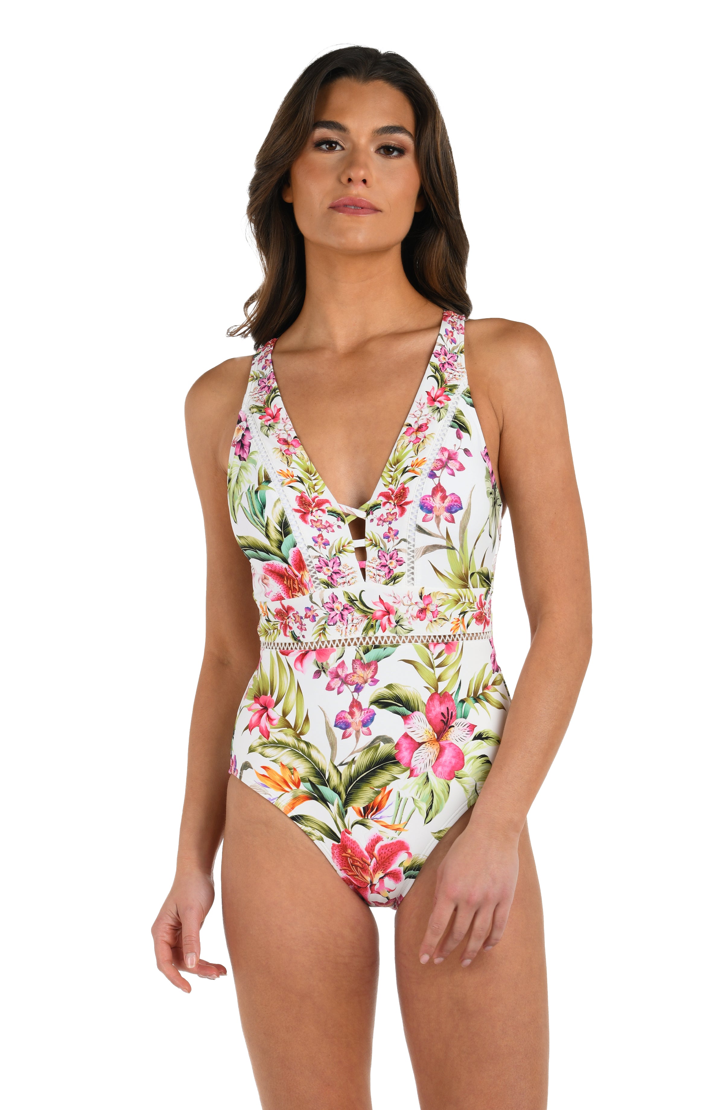 Front image of model wearing a multi-colored floral one-piece swimsuit featuring a plunging neckline with front lace-up detail, and crisscross straps across an open back.