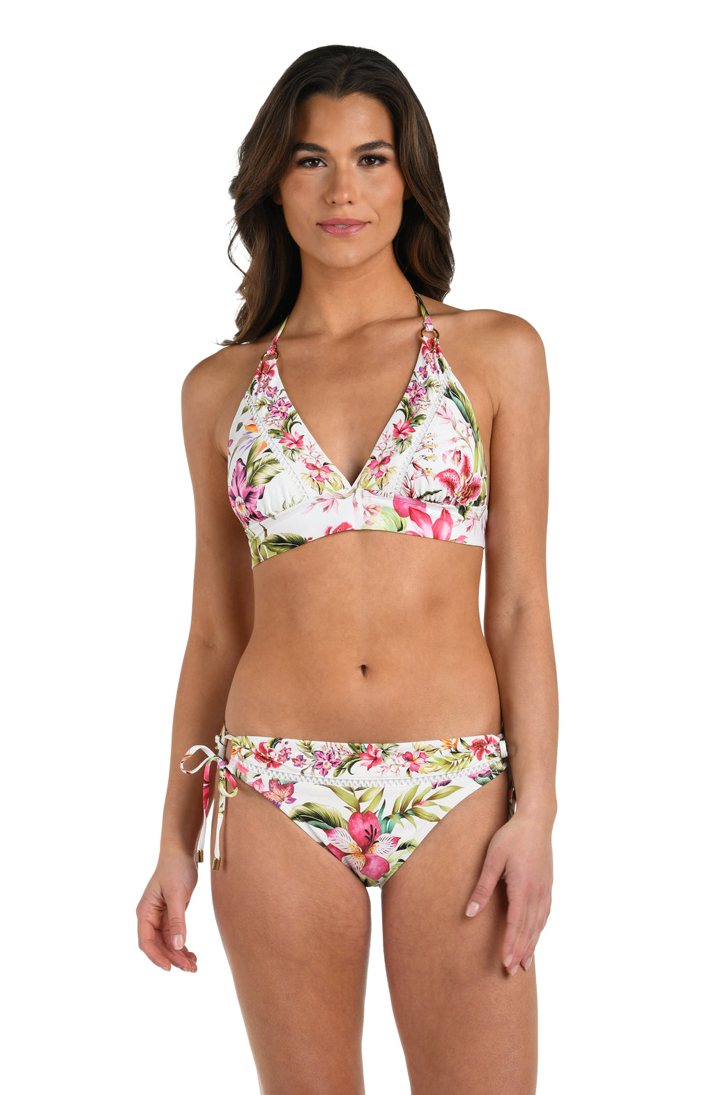 Front image of model wearing a multi-colored floral halter bikini top featuring a v-neckline, halter straps with gold rings, and a band underneath the bustline. 