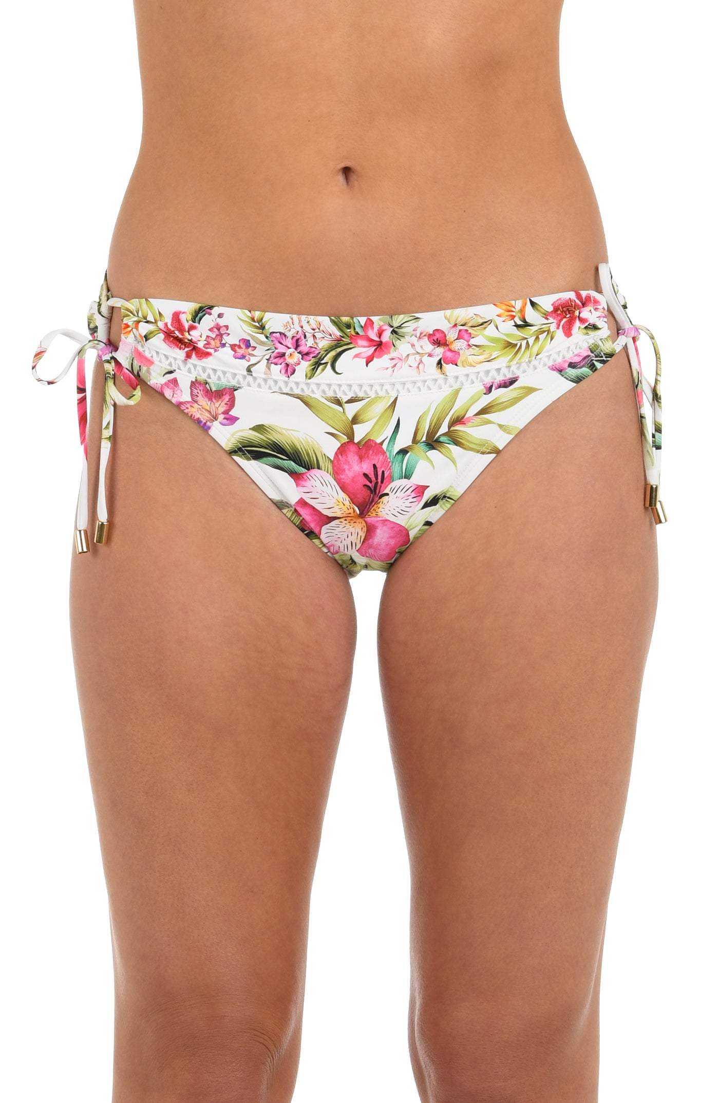 
                  
                    Front image of model wearing a white, pink, and green multicolored floral printed hipster bikini bottom featuring crochet trim and adjustable loop side ties with gold cord ends. 
                  
                