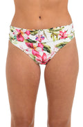 Front image of model wearing a white, pink, and green multicolored floral printed hipster bikini bottom featuring fold-over shirred banding. 