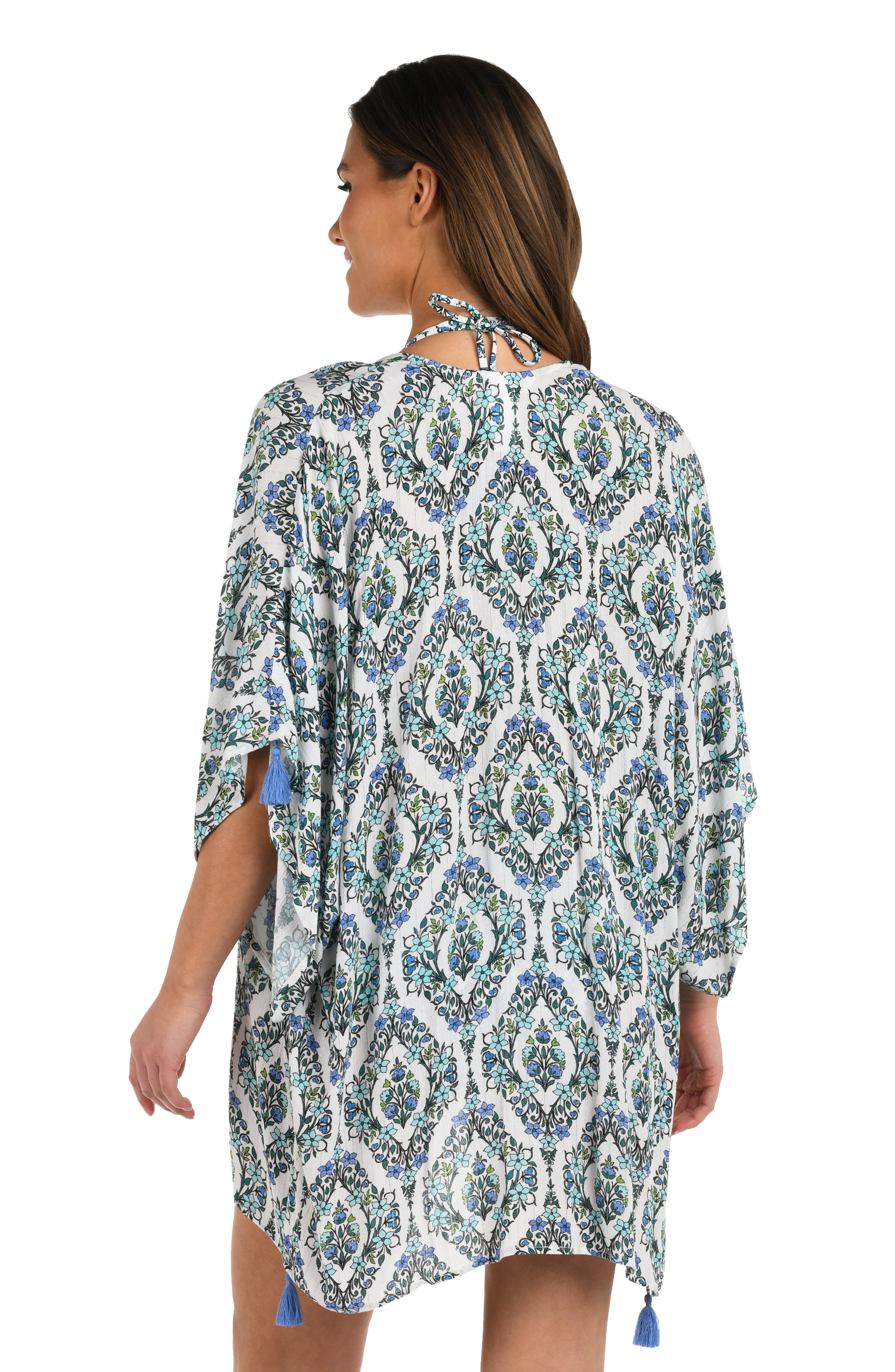 Back image of model wearing a blue and white geometric patterned open front kimono cover up. 