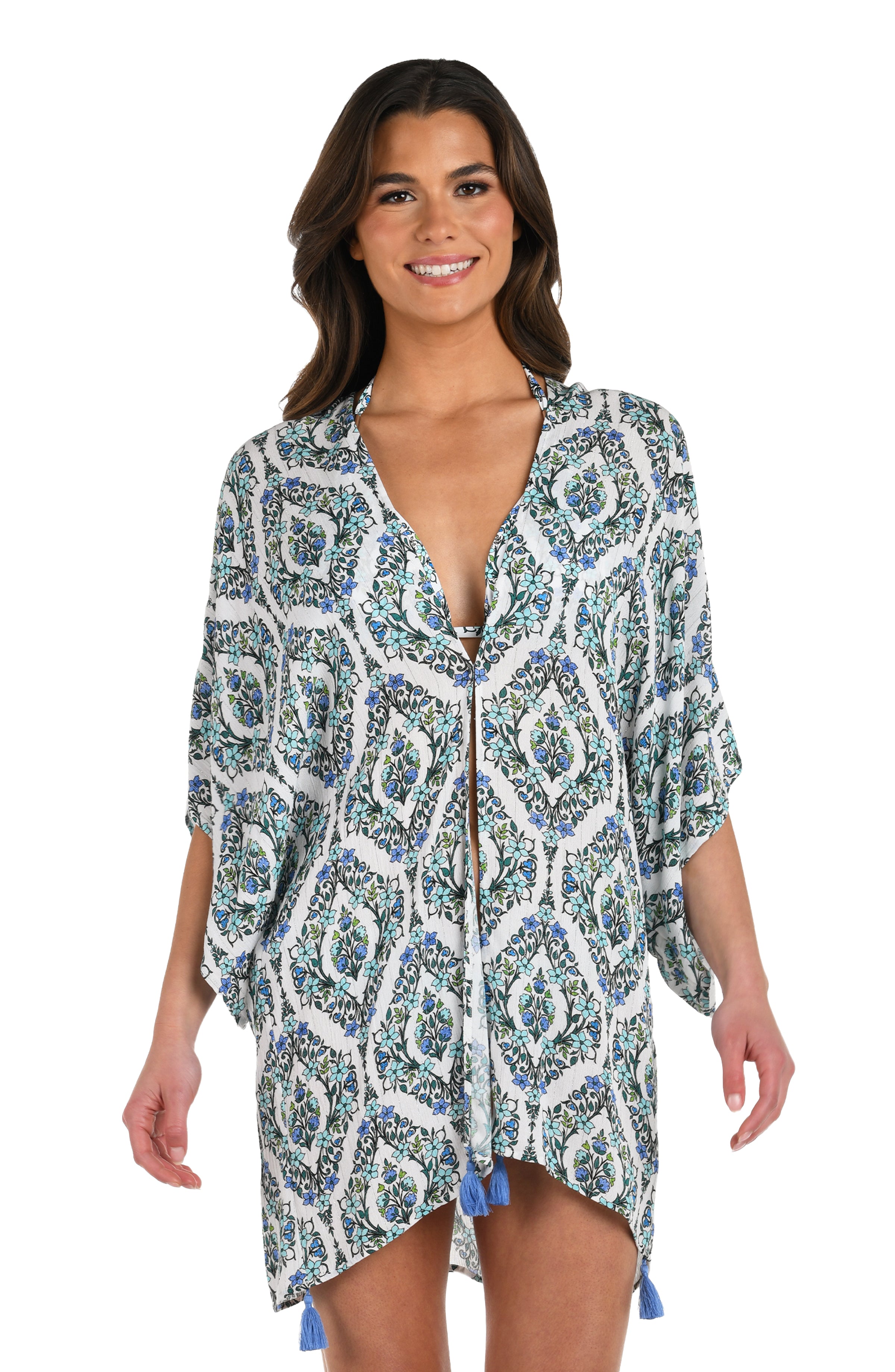 Front image of model wearing a blue and white geometric patterned kimono cover up. 