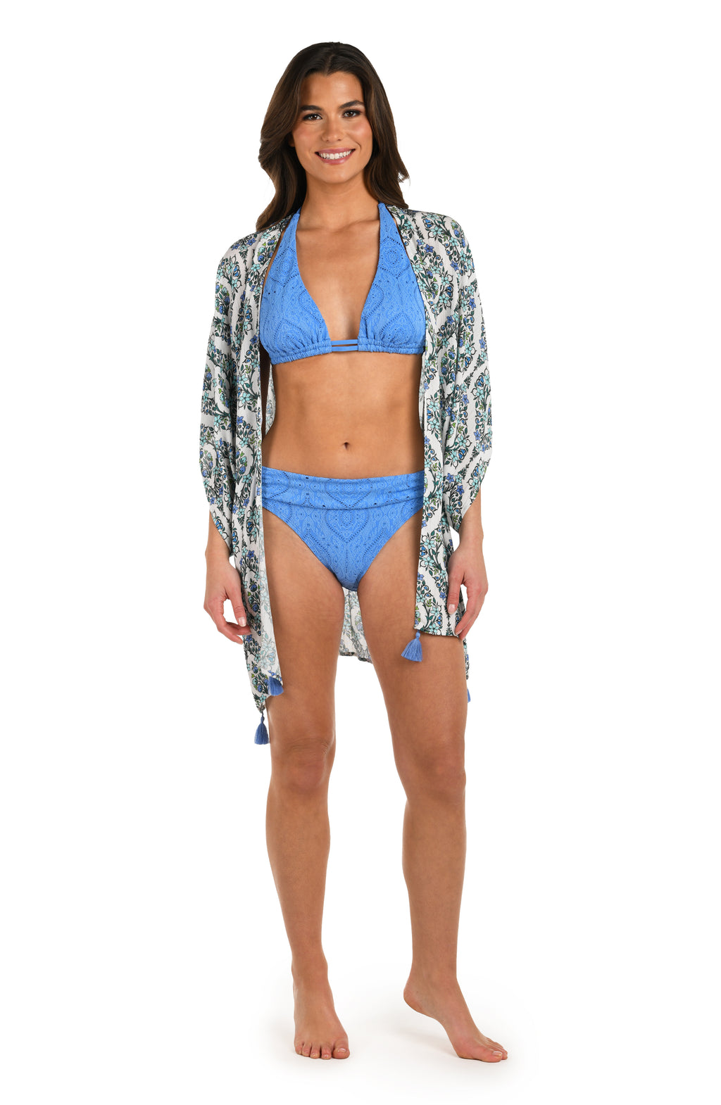 Full body front image of model wearing a blue and white geometric patterned open front kimono cover up. with a Chambray colored bikini underneath. 