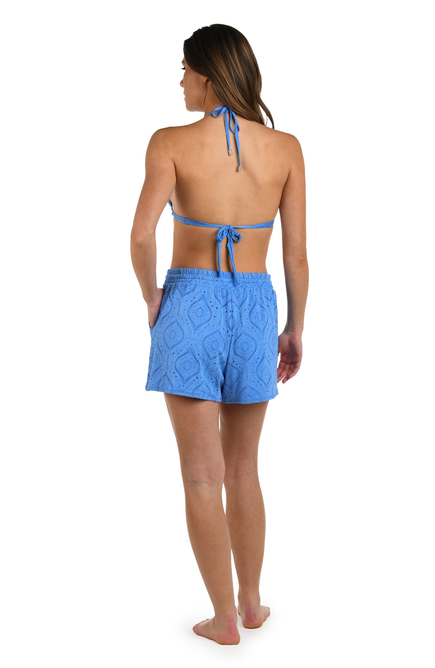 
                  
                    Full body back image of model wearing a chambray colored jacquard fabric beach shorts featuring a drawstring waist, and pockets. 
                  
                